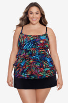 Woman wearing a rainbow light burst pattern ruffle one-piece skirtini swimsuit