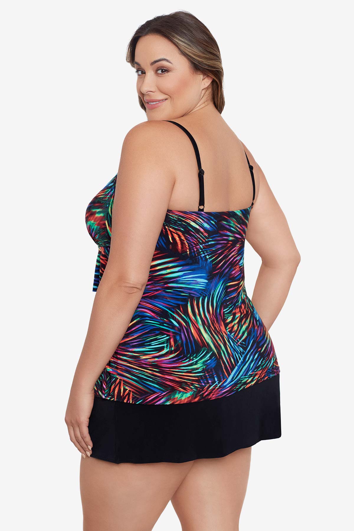Woman turned left wearing a rainbow light burst pattern ruffle one-piece skirtini swimsuit