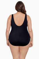 Woman turned away wearing a one-piece swimsuit