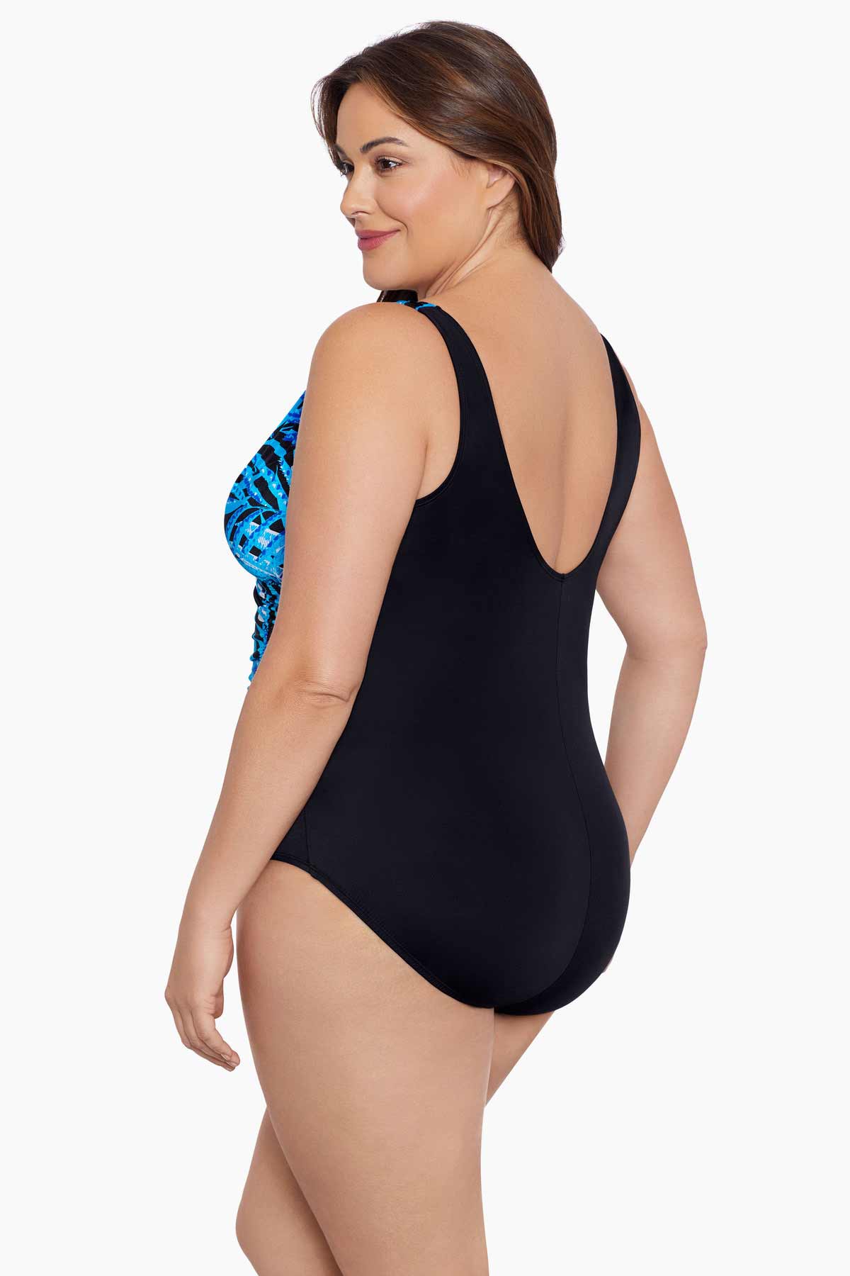 Woman turned left wearing a blue palm leaf printed one-piece swimsuit