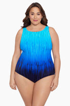 Woman wearing a blue ombre streaked print one-piece swimsuit