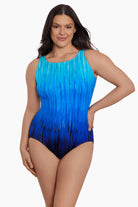 Woman wearing a blue ombre streaky pattern one piece swimsuit