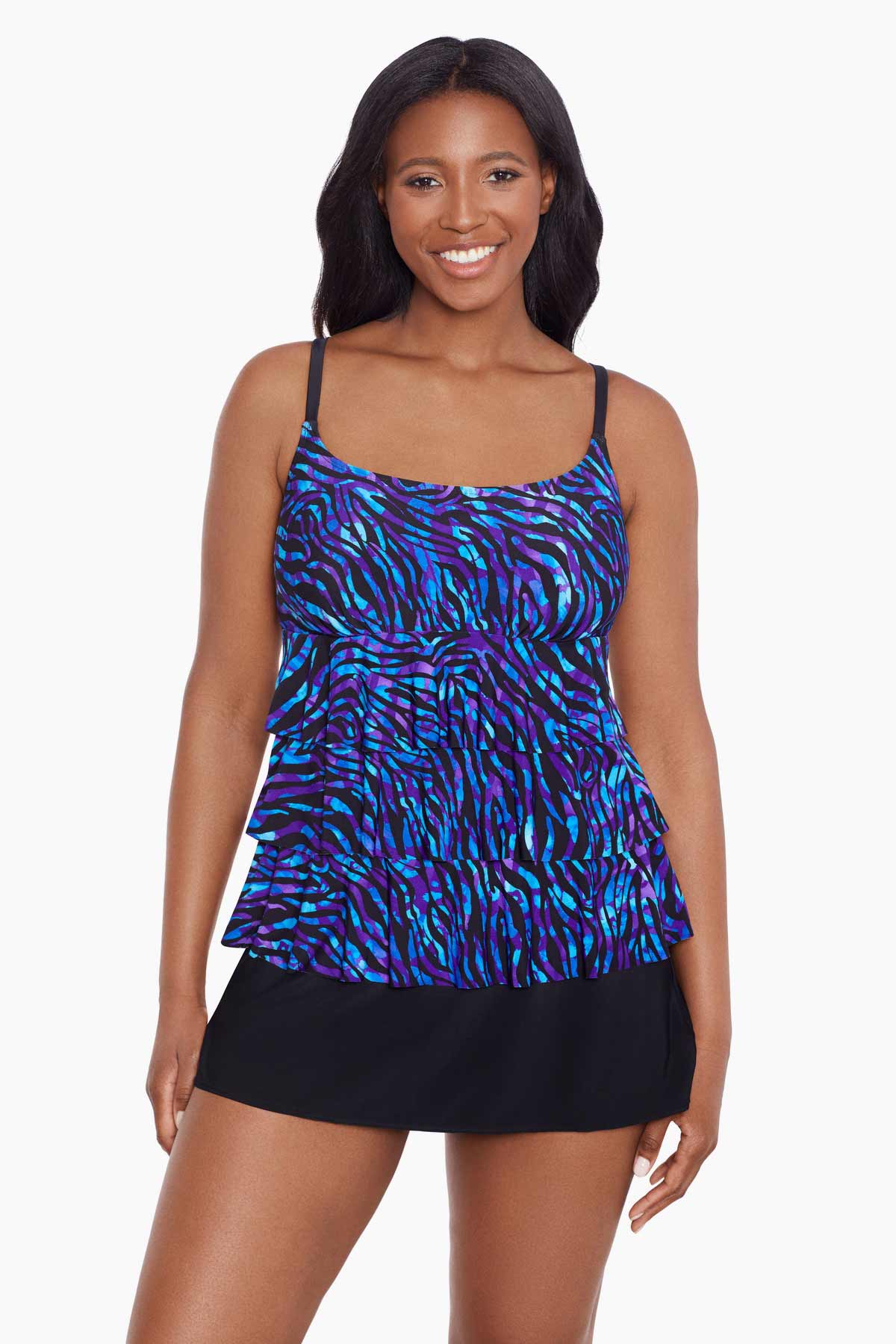 Woman wearing a black and blue safari printed ruffled skirtini swimsuit