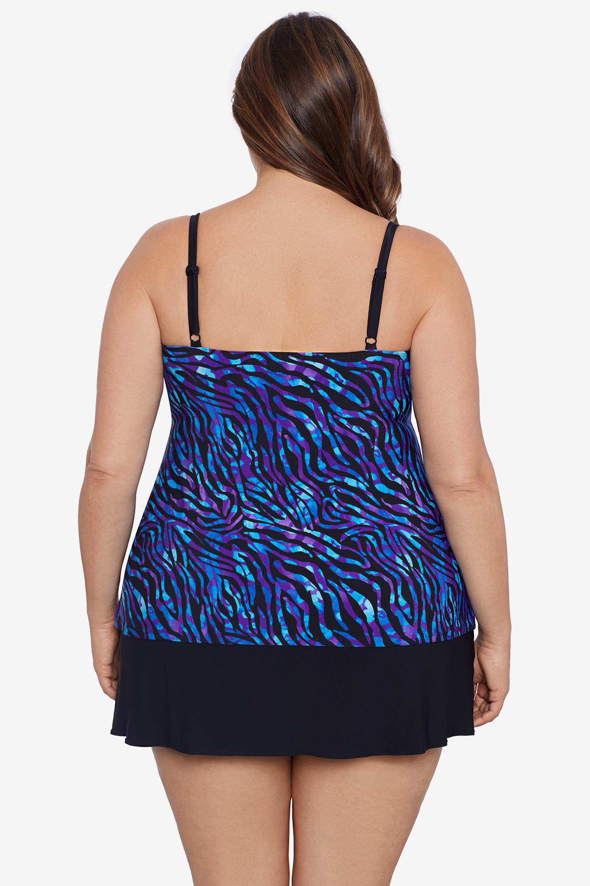Woman turned away wearing a blue animal-esque printed ruffle skirtini swimsuit