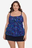 Woman wearing a blue animal-esque printed ruffle skirtini swimsuit