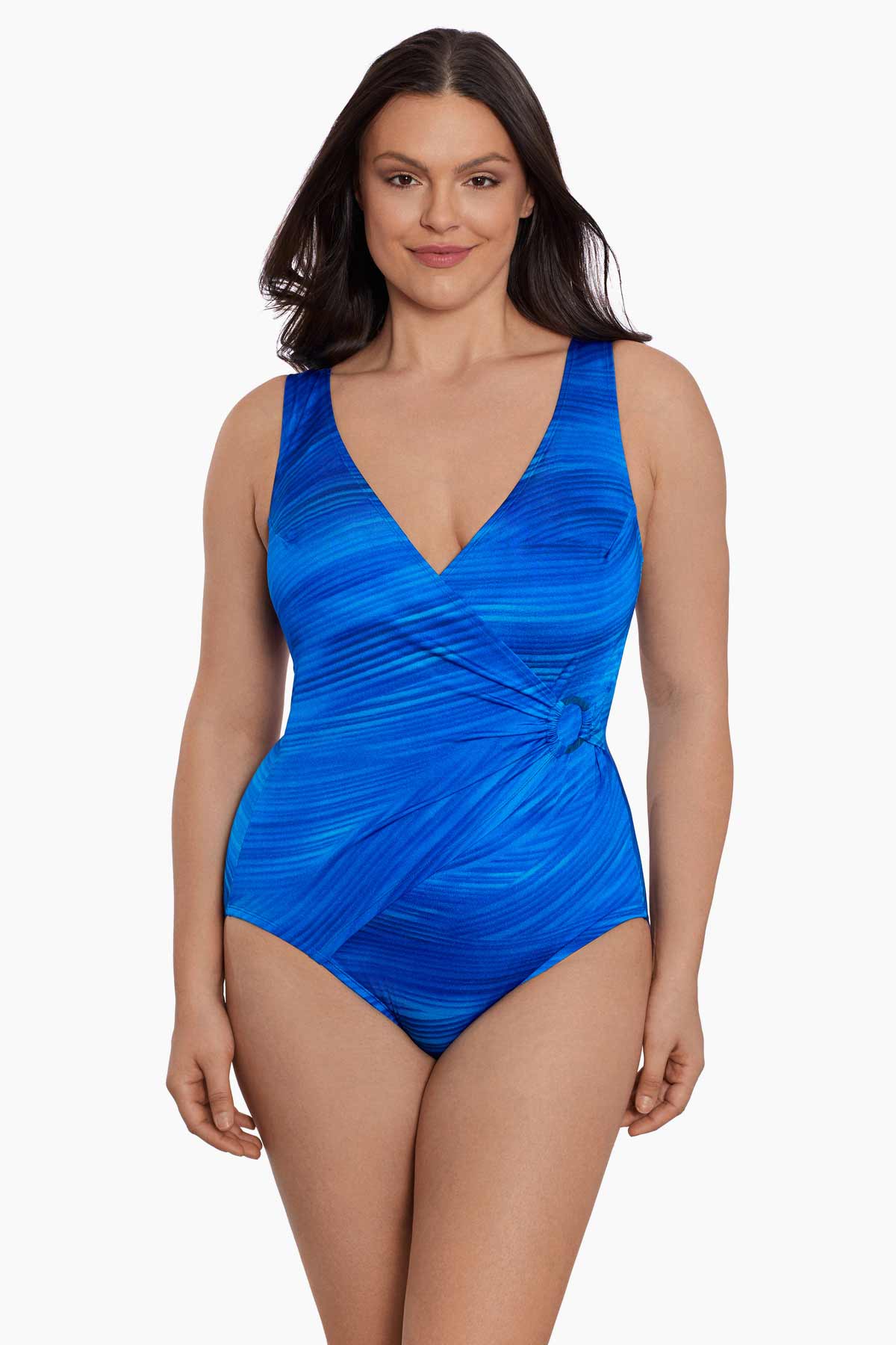 Woman wearing a blue streaked pattern one-piece swimsuit with O ring on side 