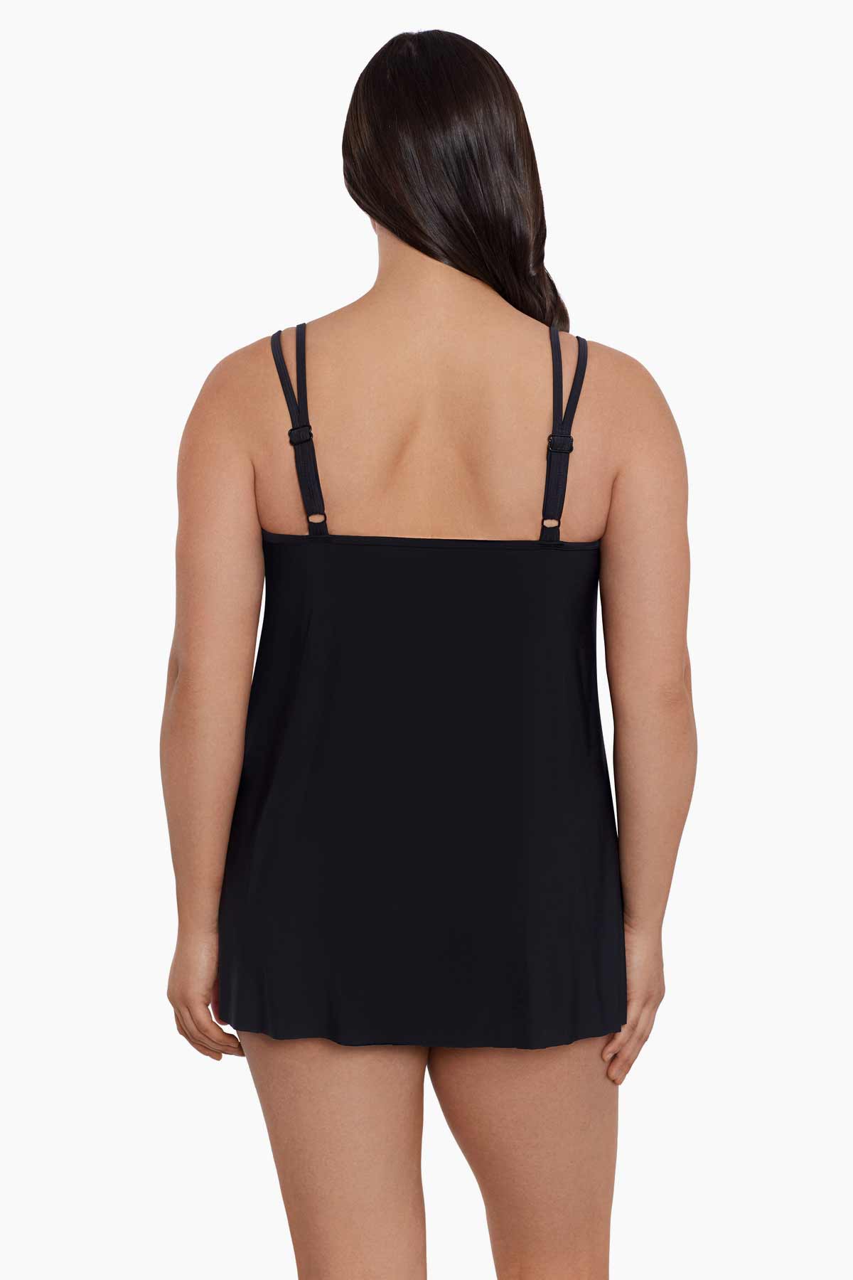 Woman faced away wearing a black drapey swim dress