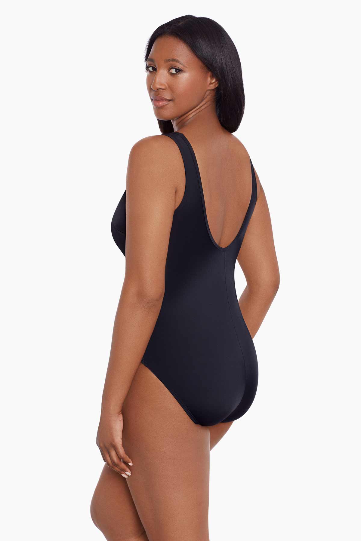 Woman faced left wearing a black mesh high neck one-piece swimsuit