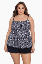 Woman wearing a black and white abstract printed ruffle shortini