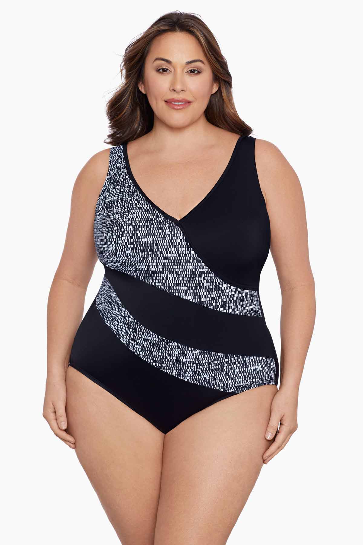 Woman wearing a black and white black blocked one-piece swimsuit