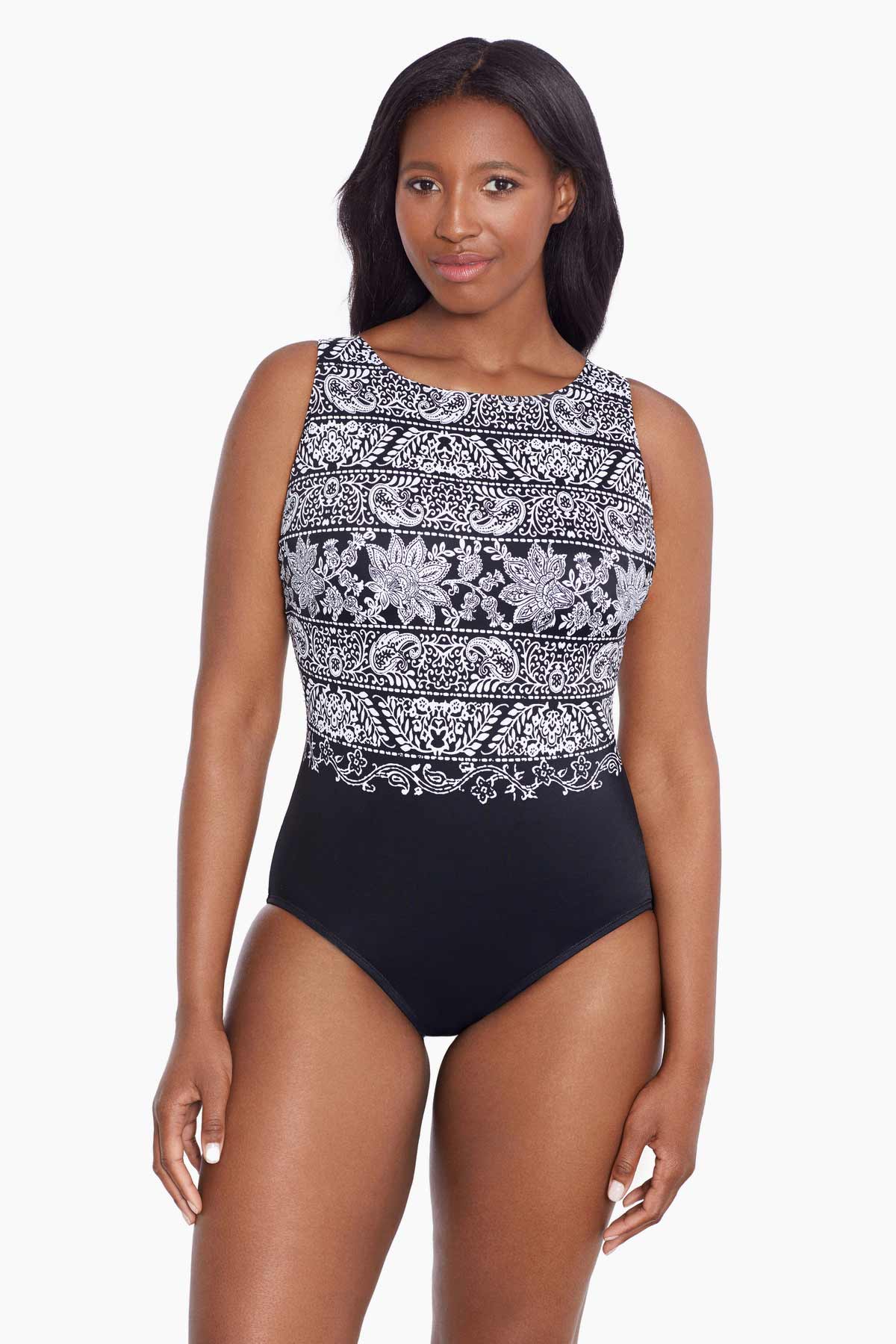 Woman wearing a black and white garland printed one-piece swimsuit