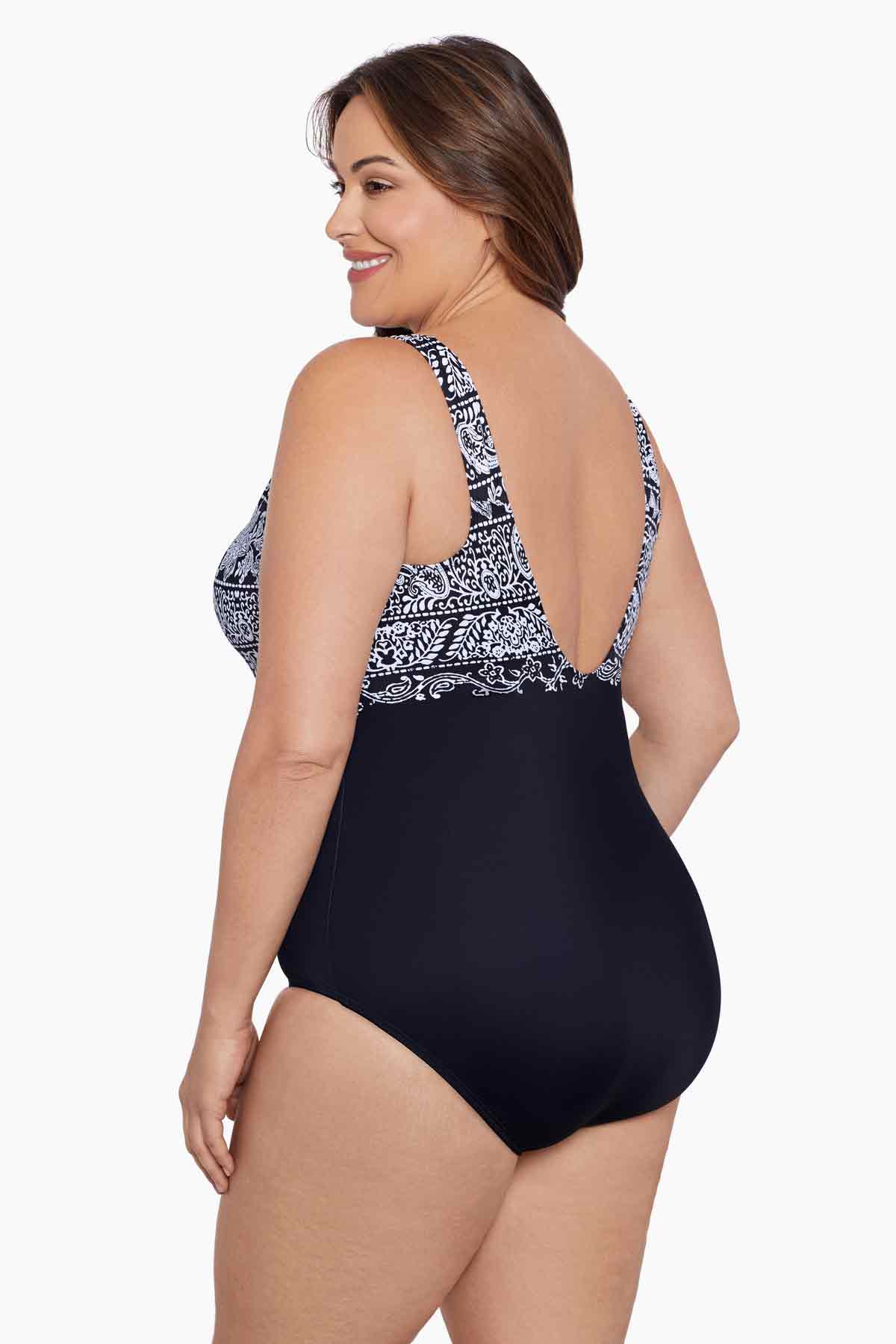 Woman turned left wearing a black and white garland printed one-piece high neck swimsuit