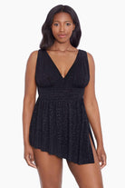 Woman wearing a black faint animal printed swim dress