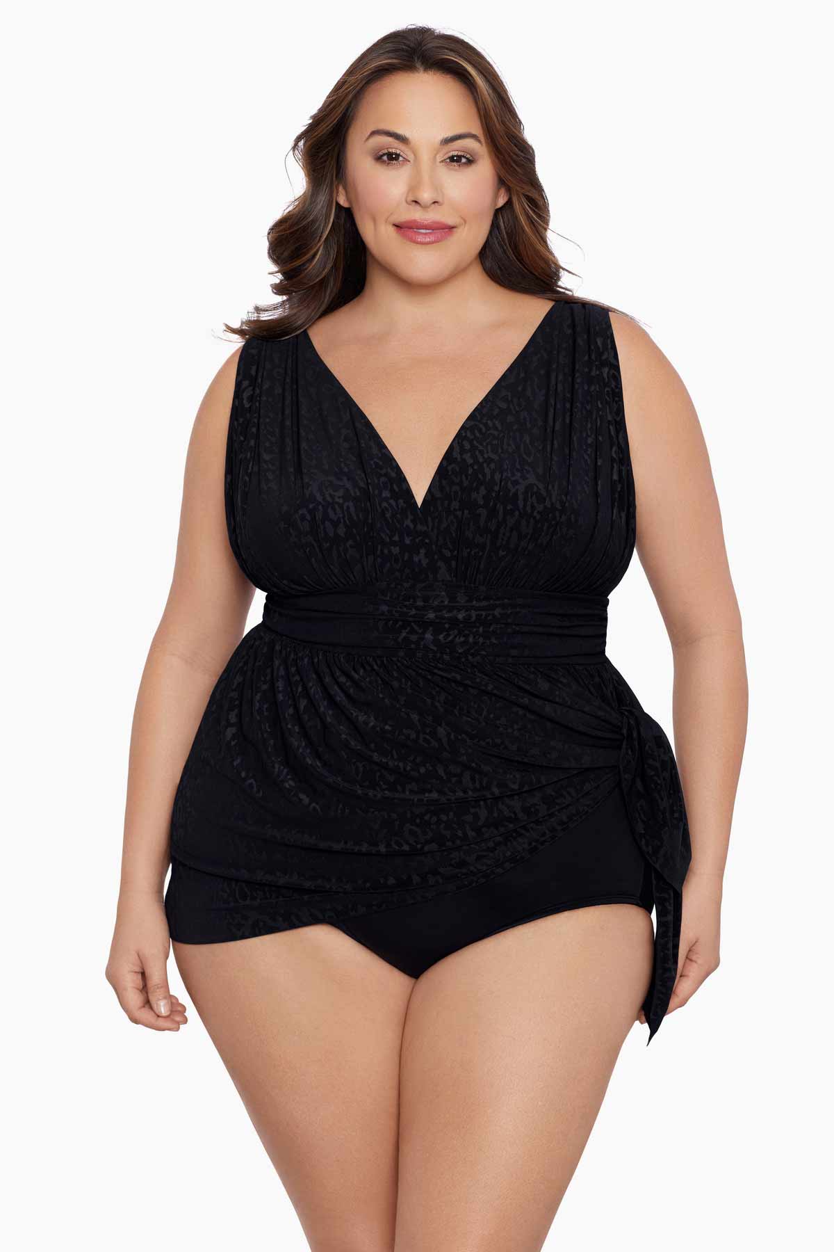 Woman wearing a black light animal-esque printed swim dress