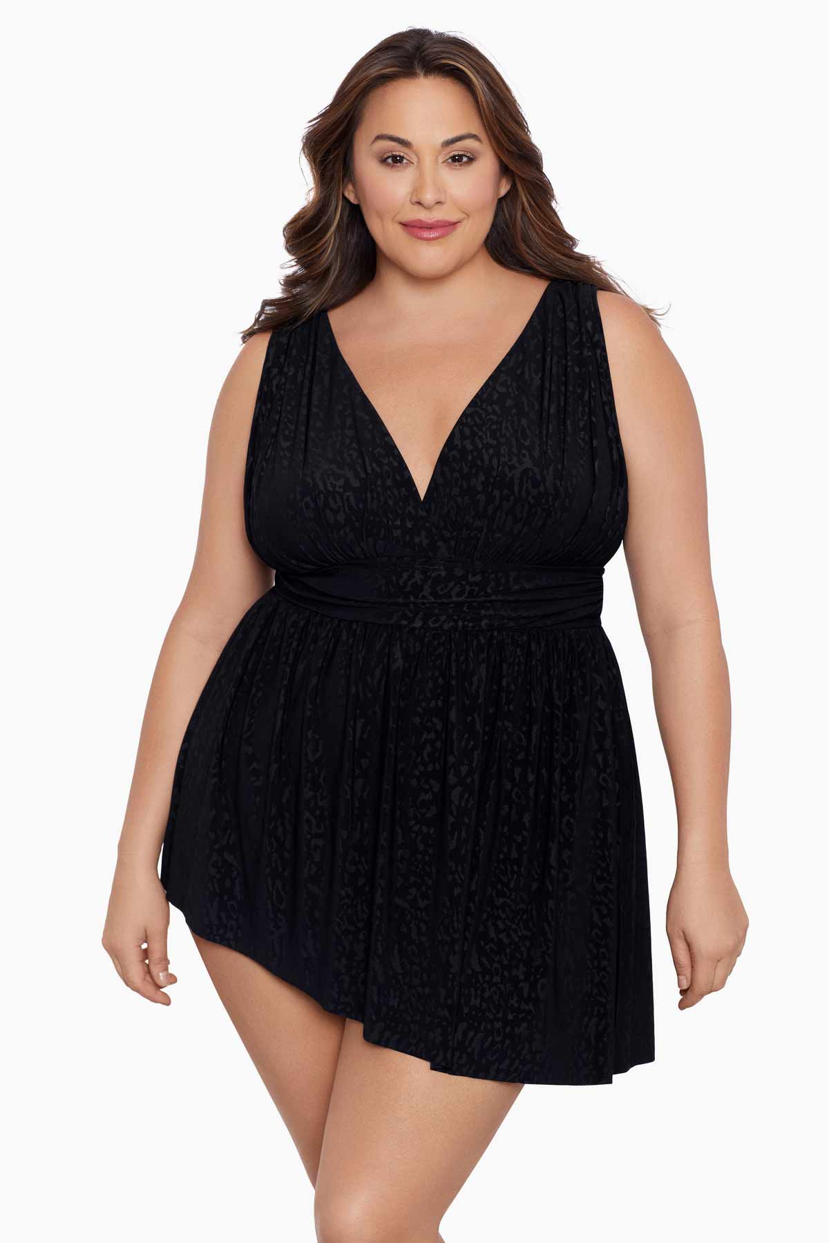 Woman wearing a black light animal-esque printed swim dress