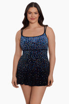 Woman wearing a multicolored dotted pattern swim dress