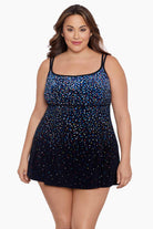 Woman wearing a multicolored speckled pattern black swim dress