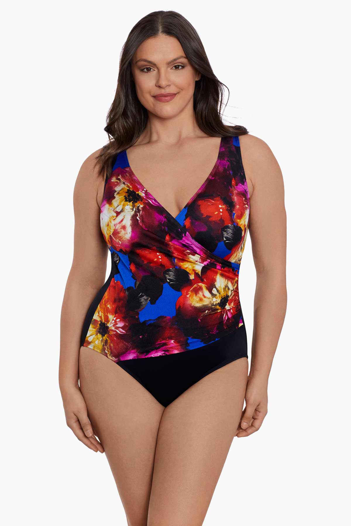 Woman wearing a multicolored watercolor one-piece swimsuit