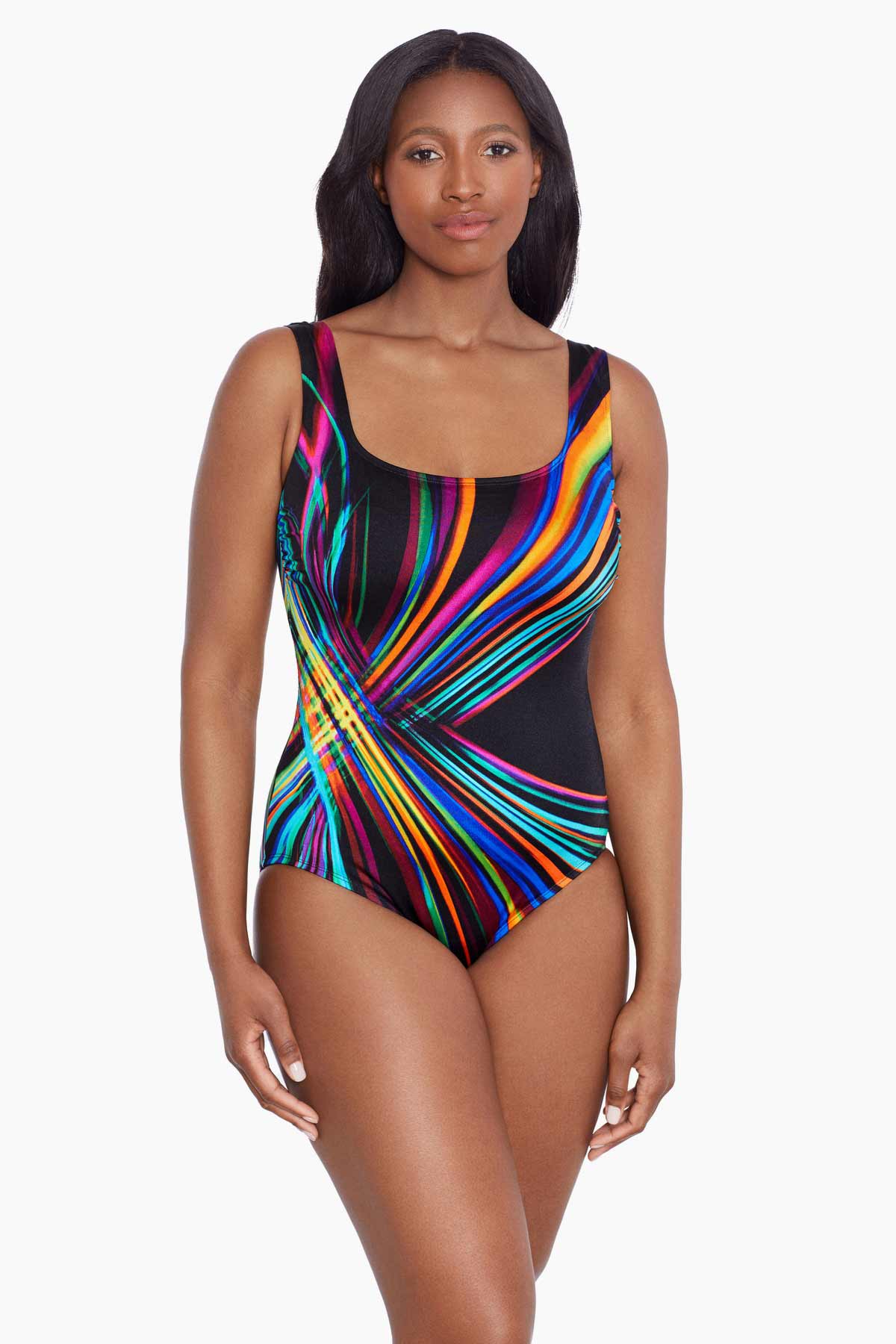 Woman wearing a multicolored stripey light pattern one-piece swimsuit