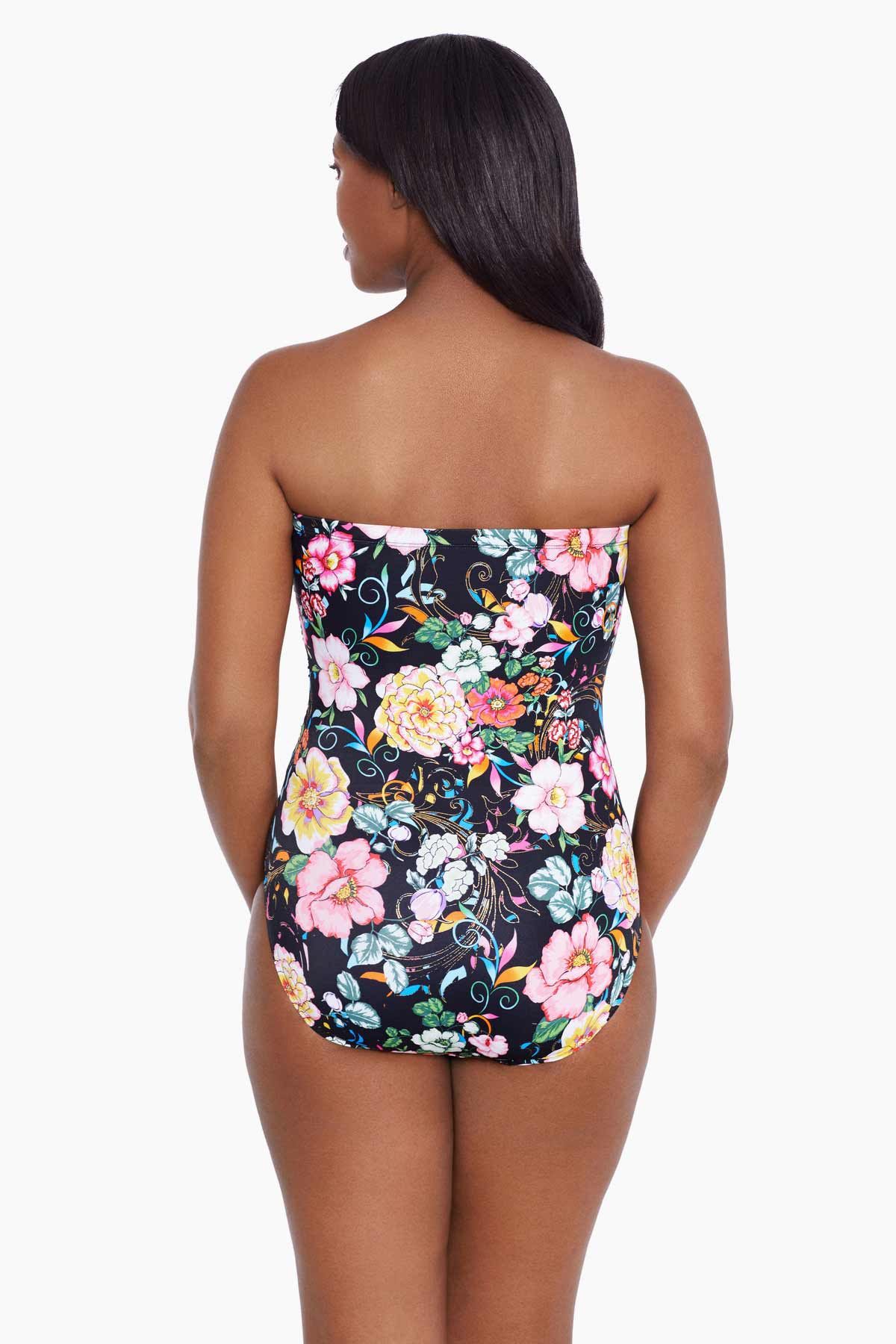 Woman faced away wearing a floral printed bandeau one-piece swimsuit