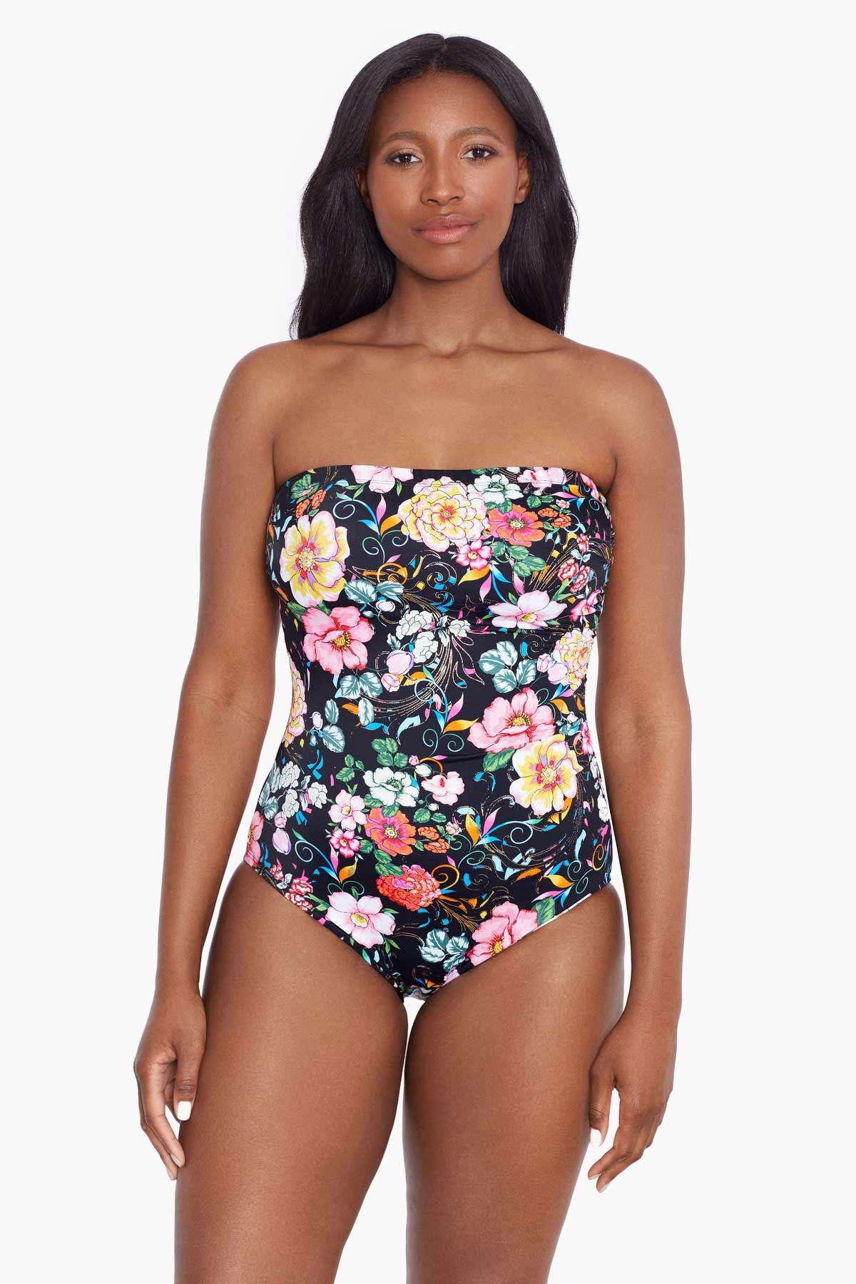 Woman wearing a floral printed bandeau one-piece swimsuit