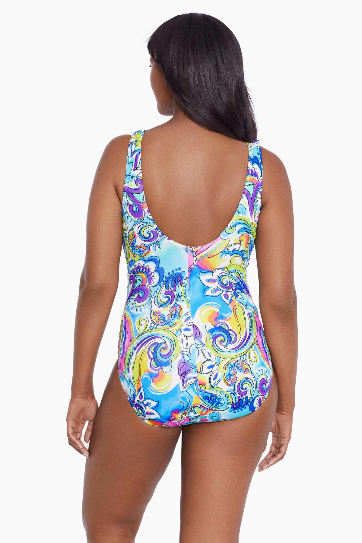 Woman faced away wearing a brightly colored paisley print one-piece swimsuit