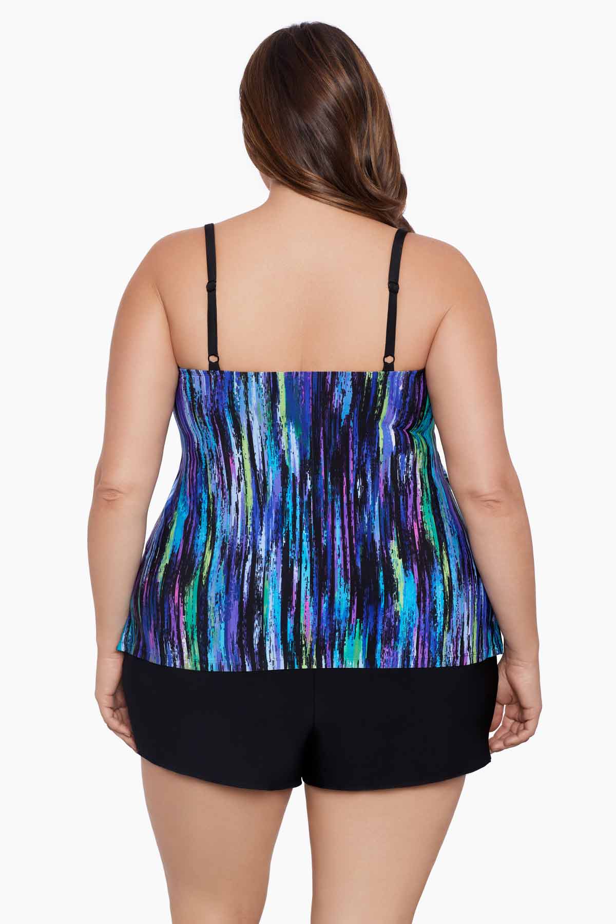 Woman turned away wearing a blue and green streak printed ruffle shortini swimsuit