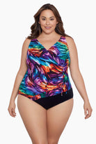 Woman wearing a rainbow ribbon pattern one-piece swimsuit