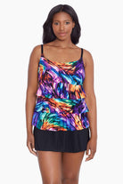Woman wearing a rainbow ribbon printed ruffle skirtini swimsuit