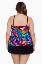 Woman turned away wearing a rainbow ribbon printed ruffle skirtini swimsuit