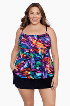 Woman wearing a rainbow ribbon printed ruffle skirtini swimsuit