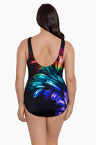 Woman turned away wearing a rainbow ribbon printed one-piece swimsuit