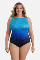 Woman wearing a blue ombre one-piece swimsuit with shimmer detail