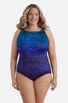 Woman wearing a blue ombre animal-esque printed one-piece swimsuit