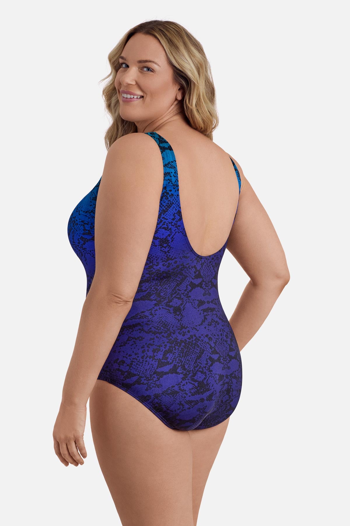 Woman turned left wearing a blue ombre animal-esque printed one-piece swimsuit