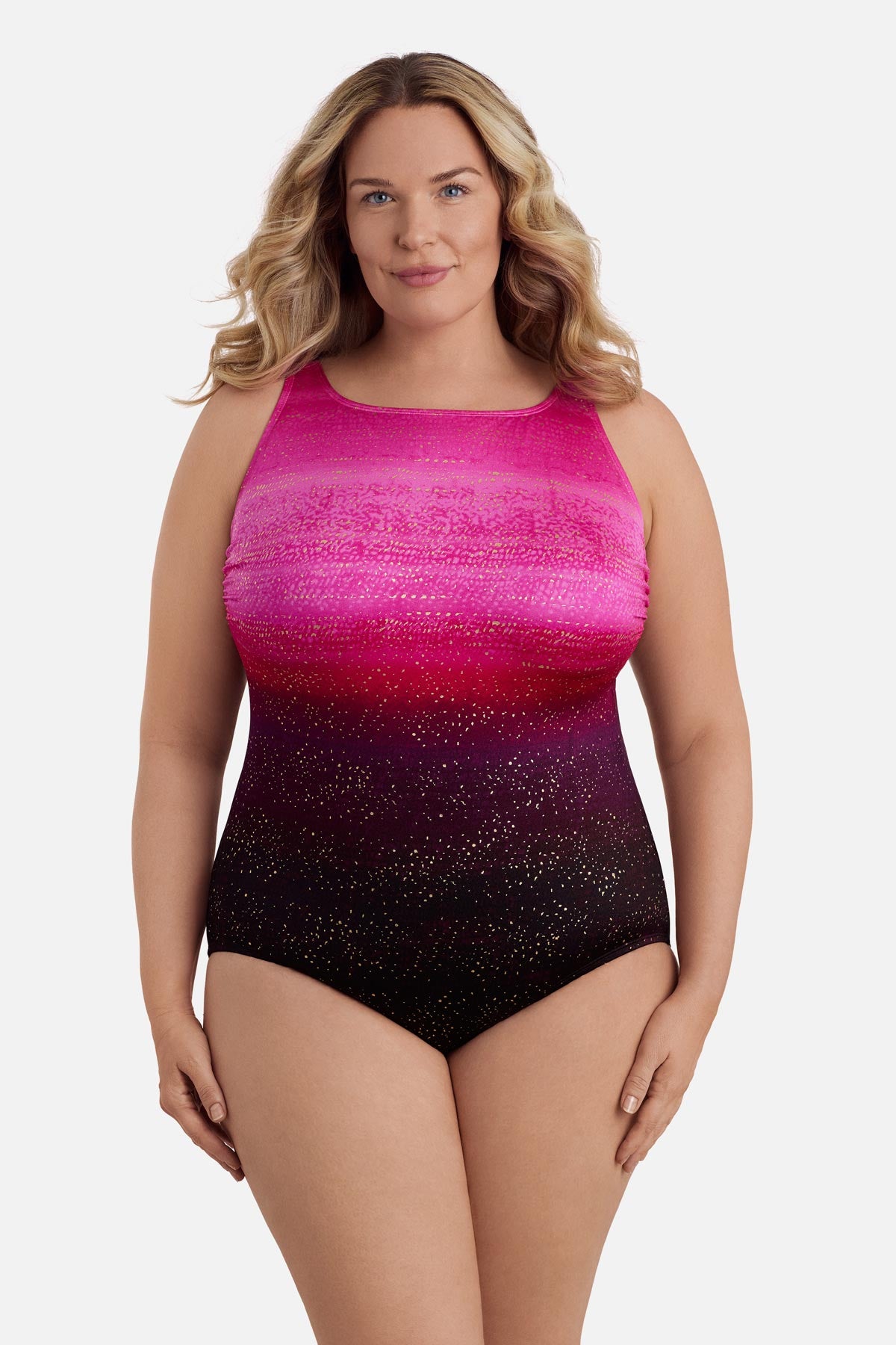 Woman wearing a pink ombre one-piece swimsuit with shimmer detail