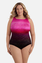 Woman wearing a pink ombre one-piece swimsuit with shimmer detail