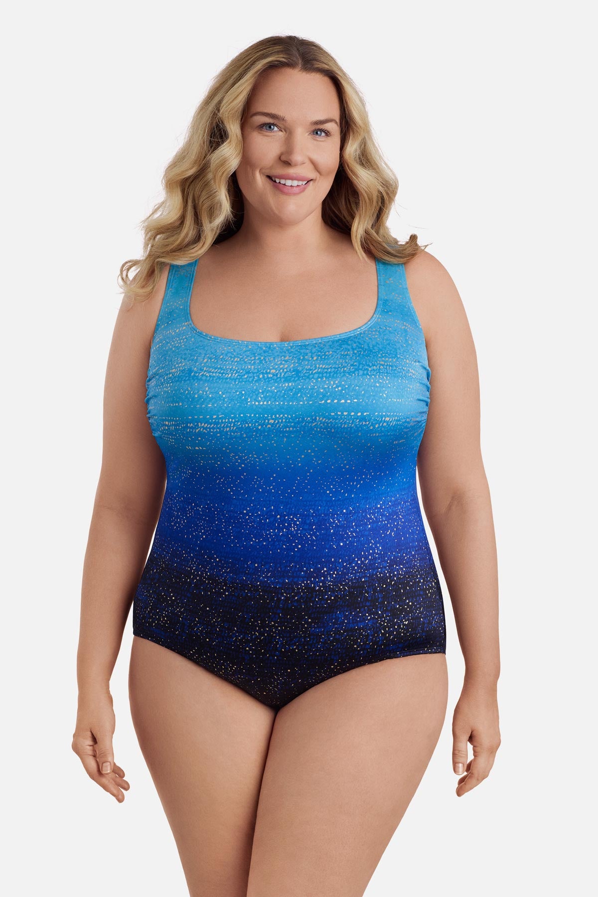 Woman wearing a blue ombre one-piece swimsuit with shimmer detail