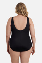 Woman turned away wearing a one-piece swimsuit 