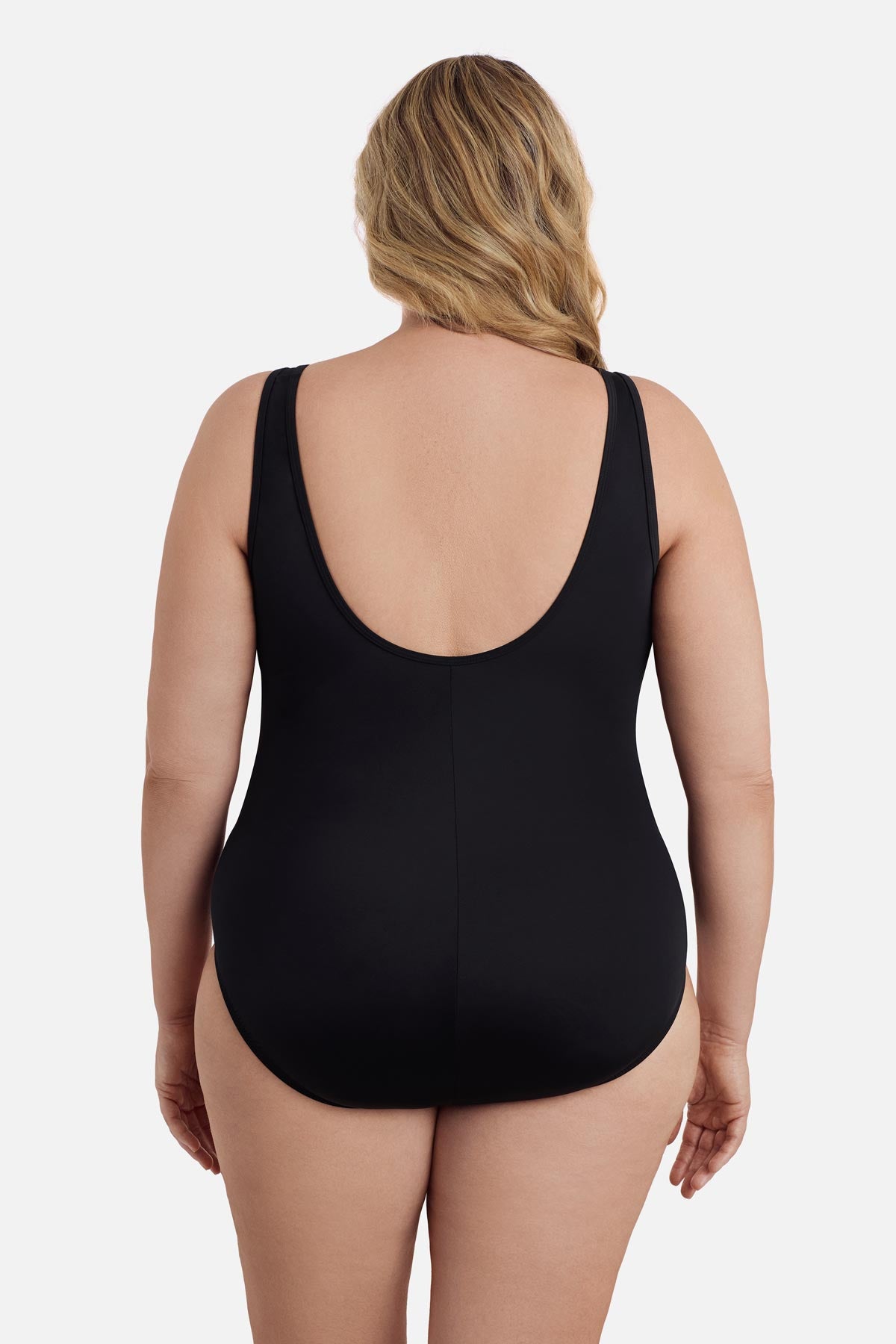 Woman faced away wearing a black mesh high neck one-piece swimsuit