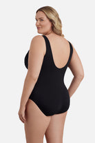 Woman faced left wearing a black mesh high neck one-piece swimsuit