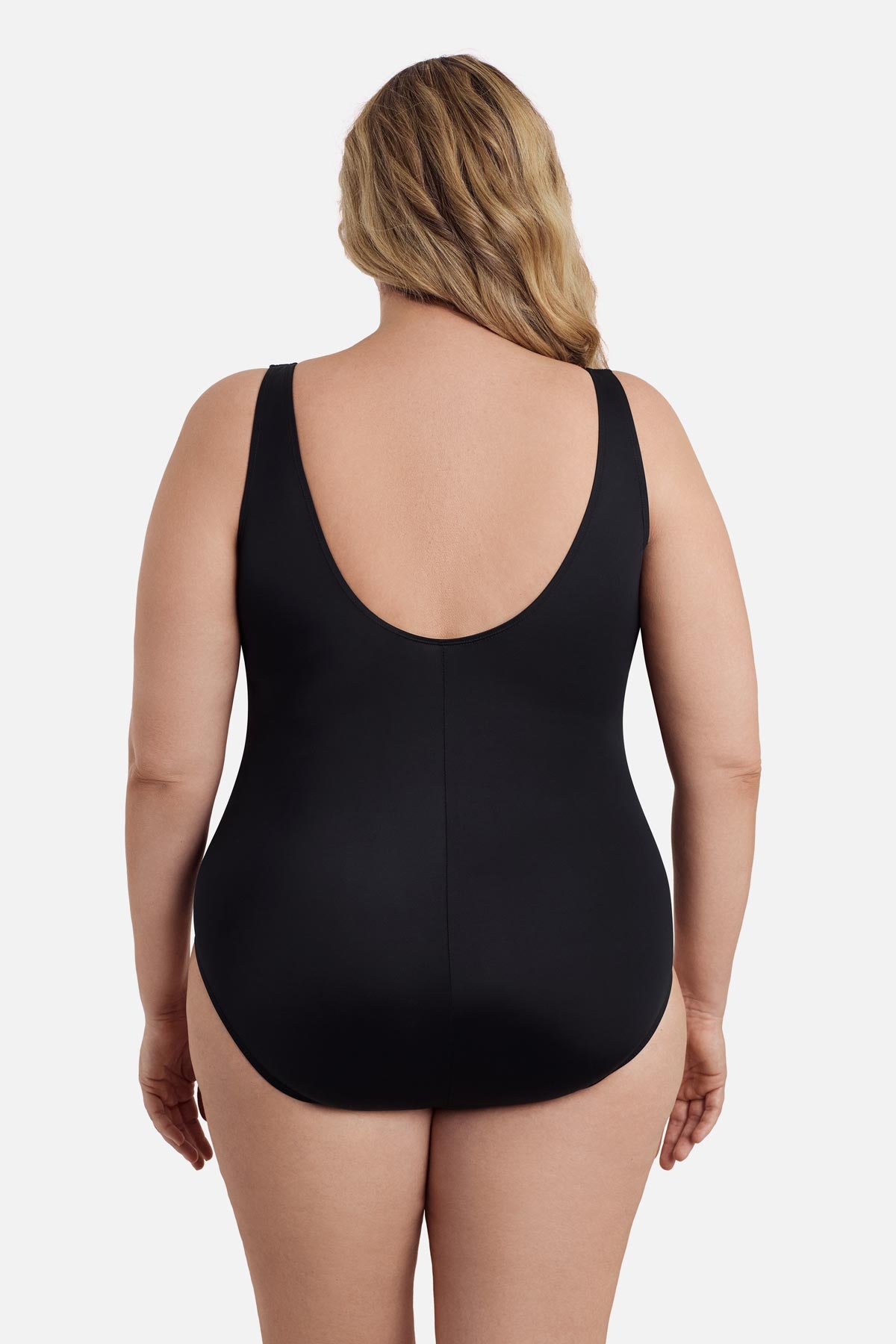 Woman faced away wearing a black one-piece swimsuit