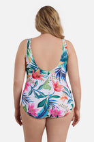 Woman turned away wearing a multicolored floral printed one-piece swimsuit