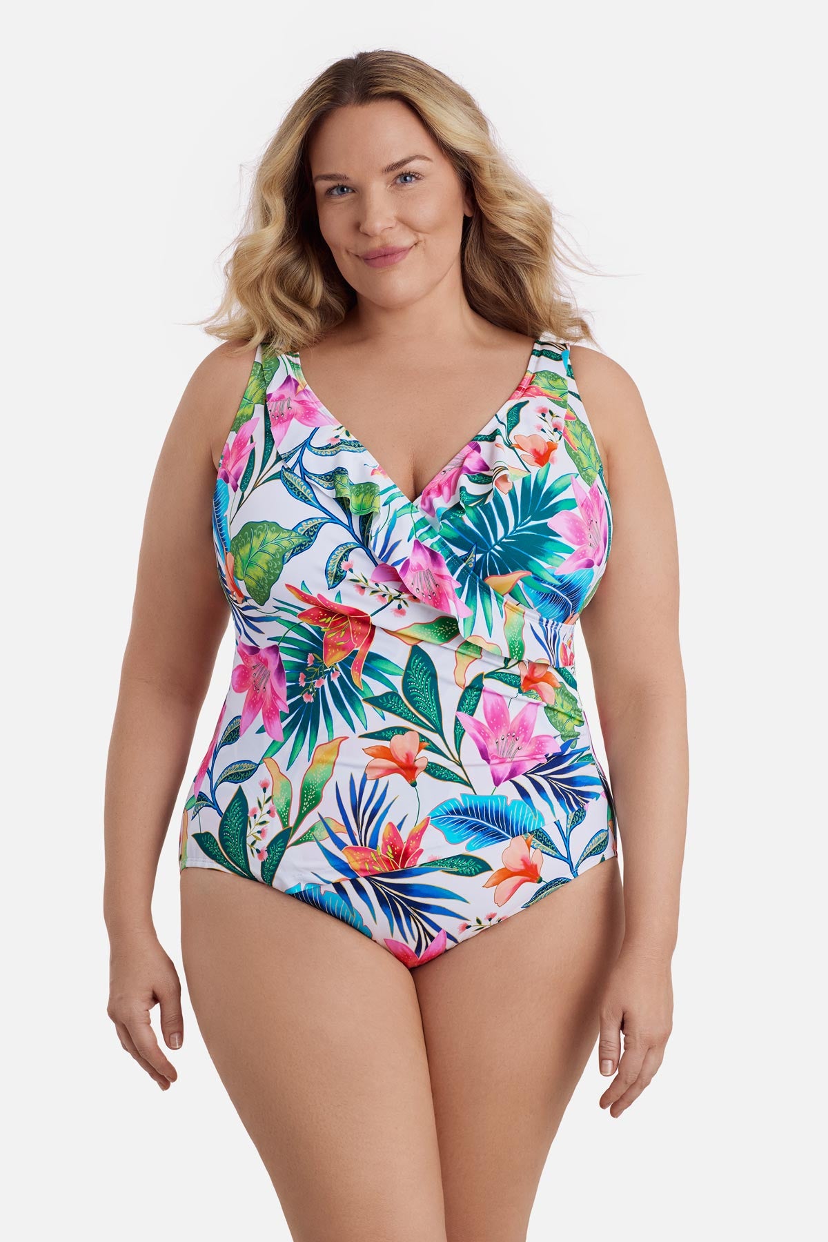 Woman wearing a multicolored floral printed one-piece swimsuit with ruffles