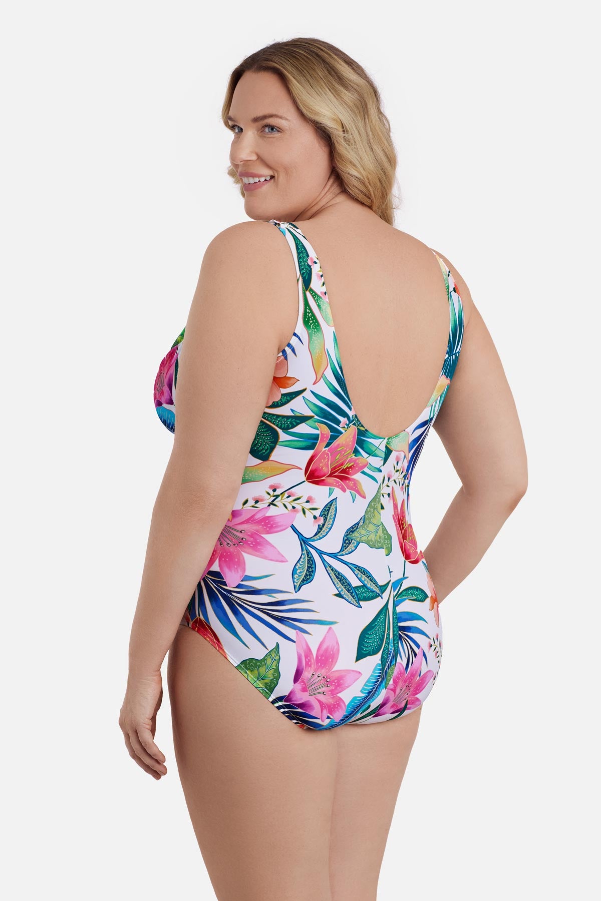 Woman turned left wearing a multicolored floral printed one-piece swimsuit