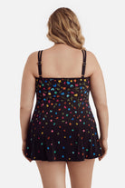 Woman turned away wearing a multicolored floral printed swim dress