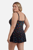 Woman turned left wearing a multicolored floral printed swim dress