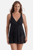 Woman wearing a black crochet swim dress