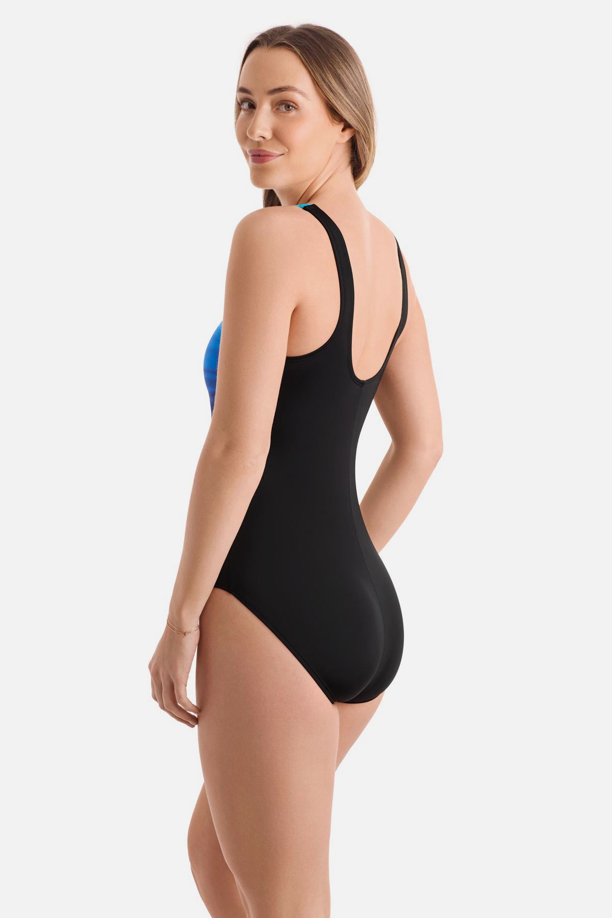 Woman turned left wearing a black and blue gradient one-piece swimsuit