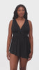 Woman wearing a black faint animal printed swim dress